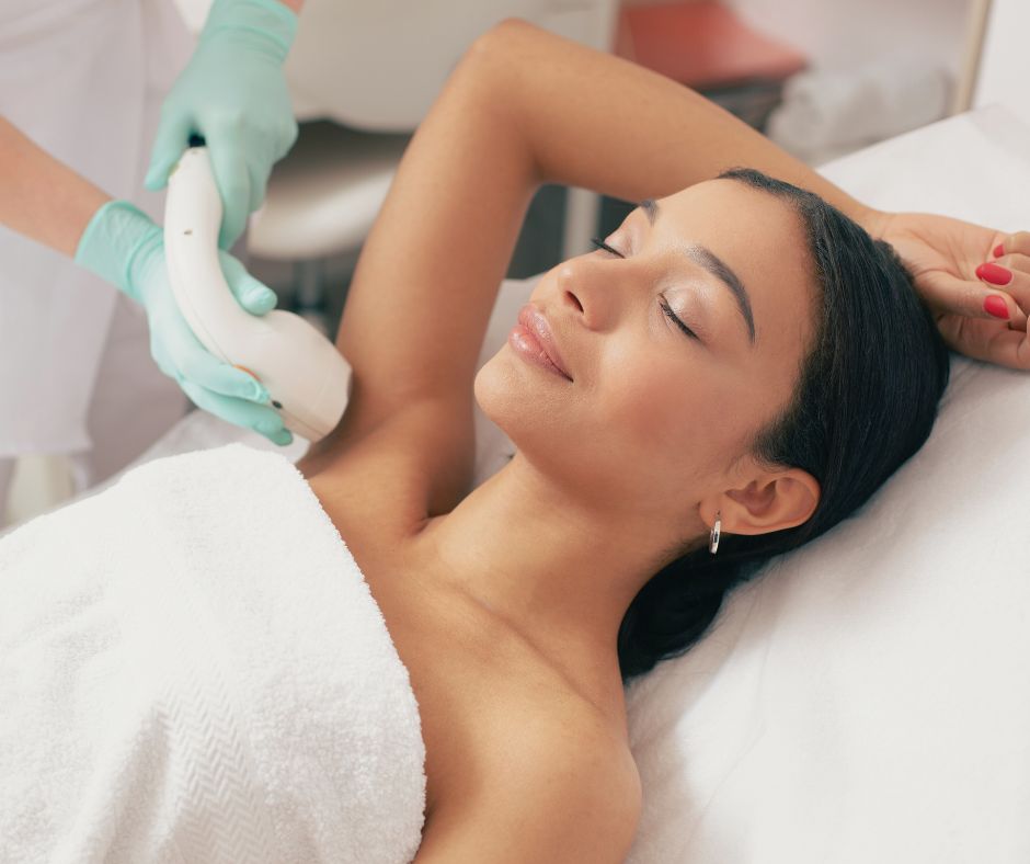 woman getting laser hair removal on her armpit